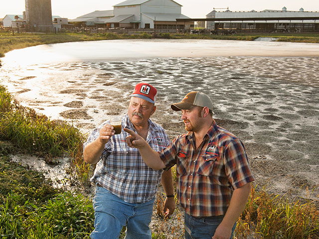 George Brand and son, David, have slurry samples tested before they write a variable-rate prescription to apply manure on their Indiana farm. (Progressive Farmer photo by Dave Charrlin)